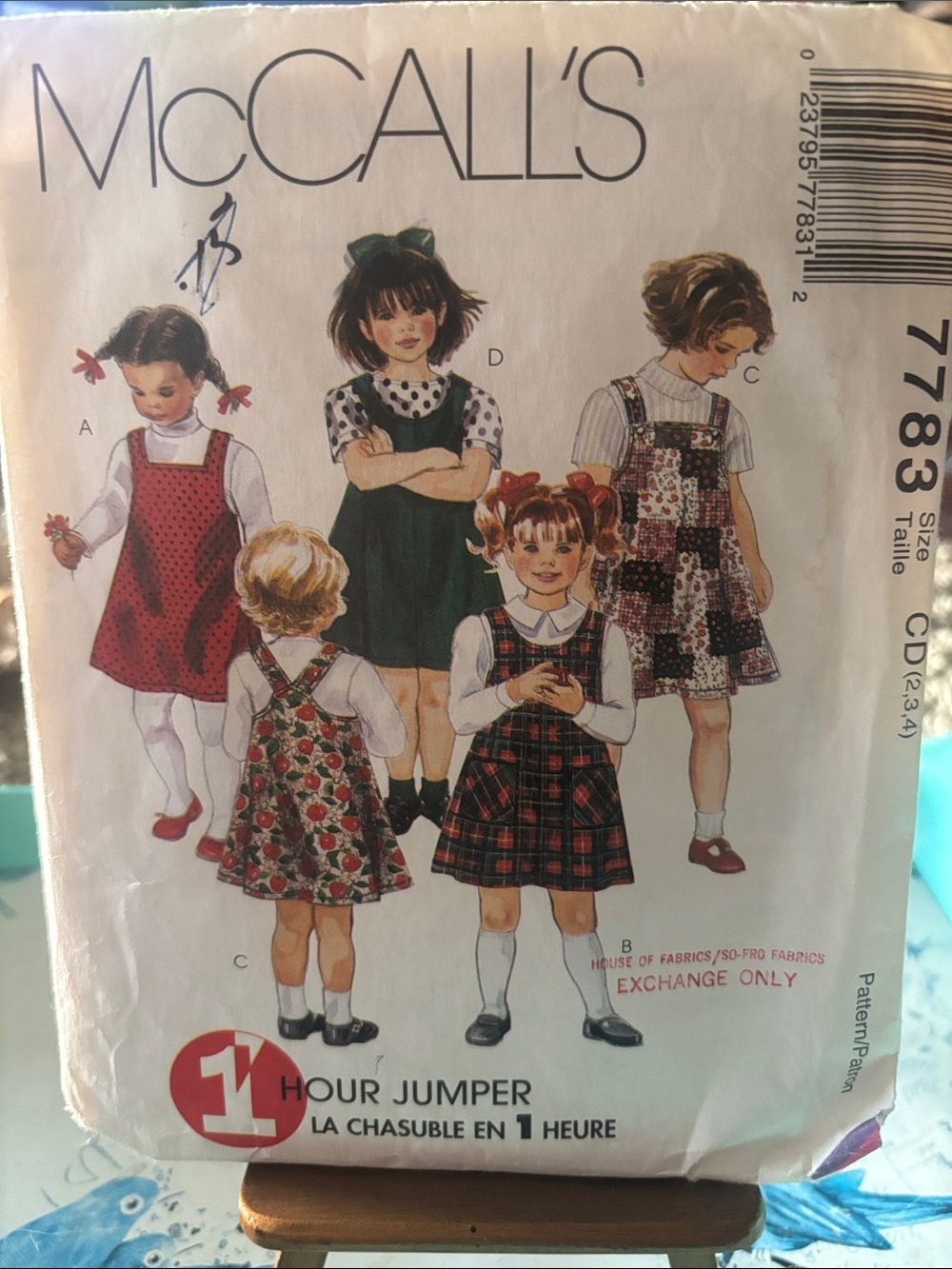 Simplicity Sewing Pattern designs for children's jumpers and dresses.